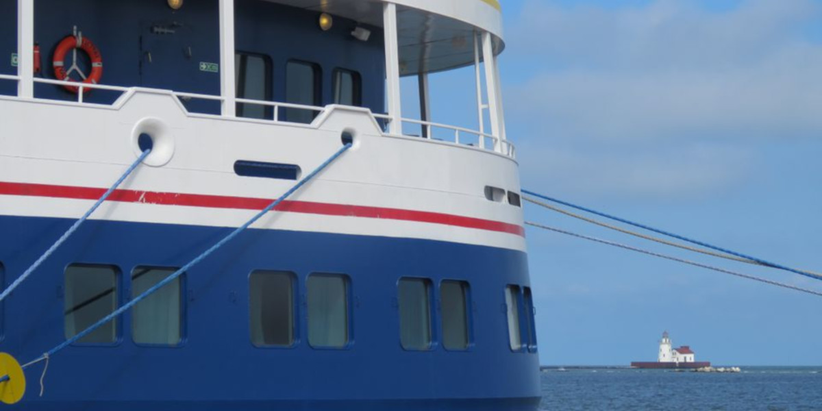 Victory I docked in Cleveland with lighthouse in the distance